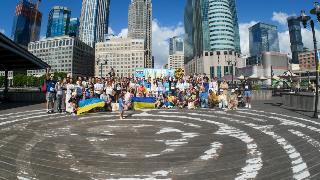 finding therapist Canada — Group of people with ukrainian flags in city